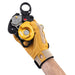 Hand model wearing glove opening Petzl Twin Release Pulley 