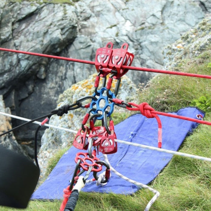 Detailed shot of the ISC HALO Red and Blue Rigging Plates and red pulleys forming a secure and versatile rope network.