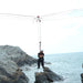 A high-angle rescue setup over coastal rocks using ISC HALO Rigging Plate and red pulleys, highlighting multi-line rigging.