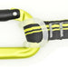 Close-up of a yellow carabiner, branded with "Kong", attached to a dark gray strap with white and yellow stitching. The strap is secured with a transparent rubber loop.