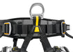 Petzl Falcon Seat Harness featuring a close up of the metal ventral attachment point which distributes the load between the waistbelt and leg loops during suspension.