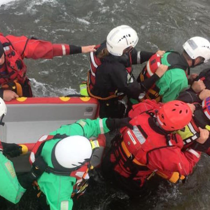 Rescue responders with WRS evacuation sled in water